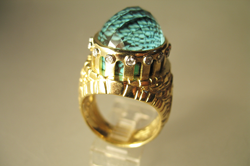 The finished ring with the faceted cabochon of Aquamarine mounted in the top of the ring