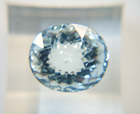 Photo of an oval light blue Aquamarine which is windowed.
