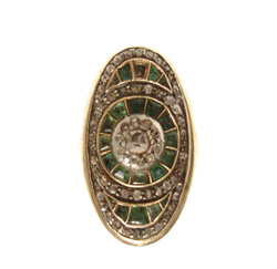 Shows the oval antique ring with dark gren stones and one missing.