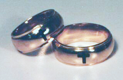 2 rings which have been inlaid with black Onyx in the shape of crosses.