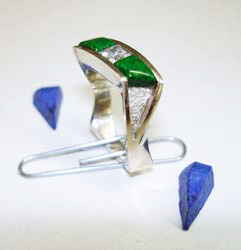 Shows the ring with the Jadeite glued in place and the unfinished Lapis pieces.