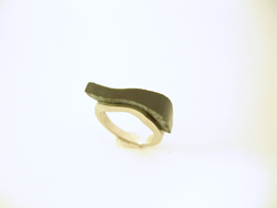 Photo shows the Black Jade inlay glued in place in the ring.