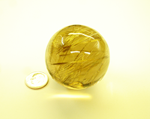 Photo of a rutillated Quartz sphere which we made into a cane handle..