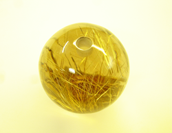 Photo showing the hold in the bottom of the Rutillated Quartz sphere.