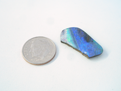 A freeform Boulder Opal with the left side broken