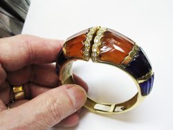 Photo of a bracelet with a broken synthetic Citrine carving.