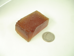 Photo of a block of synthetic Citrine rough material.