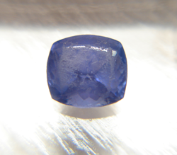 A Tanzanite which is heavily scratched.