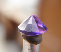 The same oval Amethyst with new facets I have cut onto the pavilion.