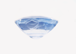 Photo of a light blue Sapphire with a large chip in the side of the pavilion.