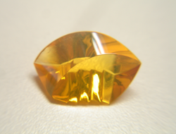 Photo of a yellow Opal fantasy cut which I repaired.