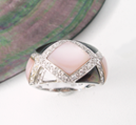 Ring with a missing Mother of Pearl inlay.