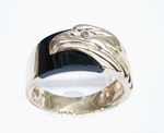 Photo of a ring with an eagle which needed the Onyx inlay repaired.