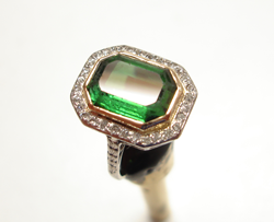Shows ring with the green Tourmaline. The table has been re-polished.