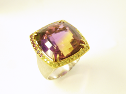 Photo of a ring with a large cushion Ametrine which needs the table re-polished.