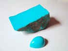 Picture of rough blue Turquoise and a turquoise cabochon.