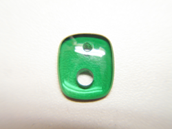 Cushion shape green cabochon with 2 holes of different sizes.