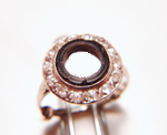 Photo of a ring broken round black Onyx with a large hole in the middle.