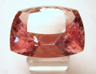 A cushion shaped faceted pink Kunzite.