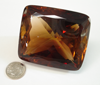 Small photo of a large 850 carat faceted gemstone. 