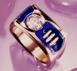 Ring with a diamond and Lapis on both sides of the Diamond.
