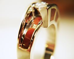 Photo of the finished diamond ring with Jasper inlays on the sides of the ring and also under the diamond.