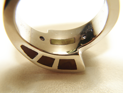 Photo showing the inside of the shank of the ring which is also inlaid so that the inlay will touch the finger.