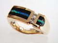 Photo of a gold ring with Opal and black Onyx inlay.