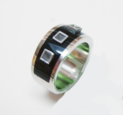 This photo shows the finished ring with the 3 square tubes sitting in the Black Jade inlay.