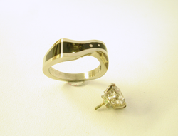 Photo shows the finished ring with the Diamond next to it.