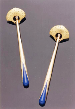 Long gold earrings with Lapis coming out of the bottom.