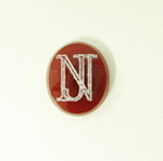 Photo of a rectangular brown Carnelian stone with the initials N J in white which were made with a laser.