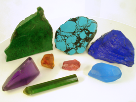 Picture of misc. rough gemstone materials of various colors.