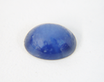 Photo of a Linde Star Sapphire cabochon which needs to be re-polished.