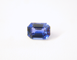 A top view of the finished emerald cut blue Sapphire which has been repaired.