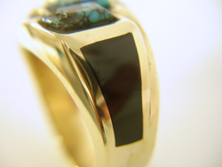 A close up photo showing how tightly the black jade is fitted in the ring.