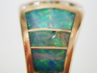 photo of an Opal inlay which has a chip and is scratched.